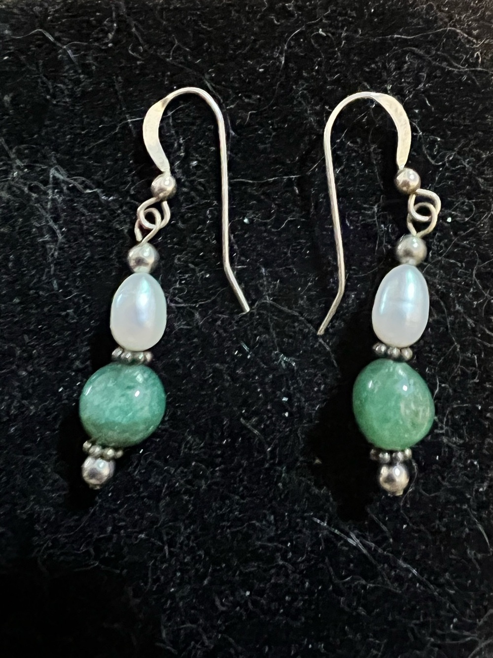 Jade and freshwater pearl with sterling silver hooks earrings. 1 1/4” long.
